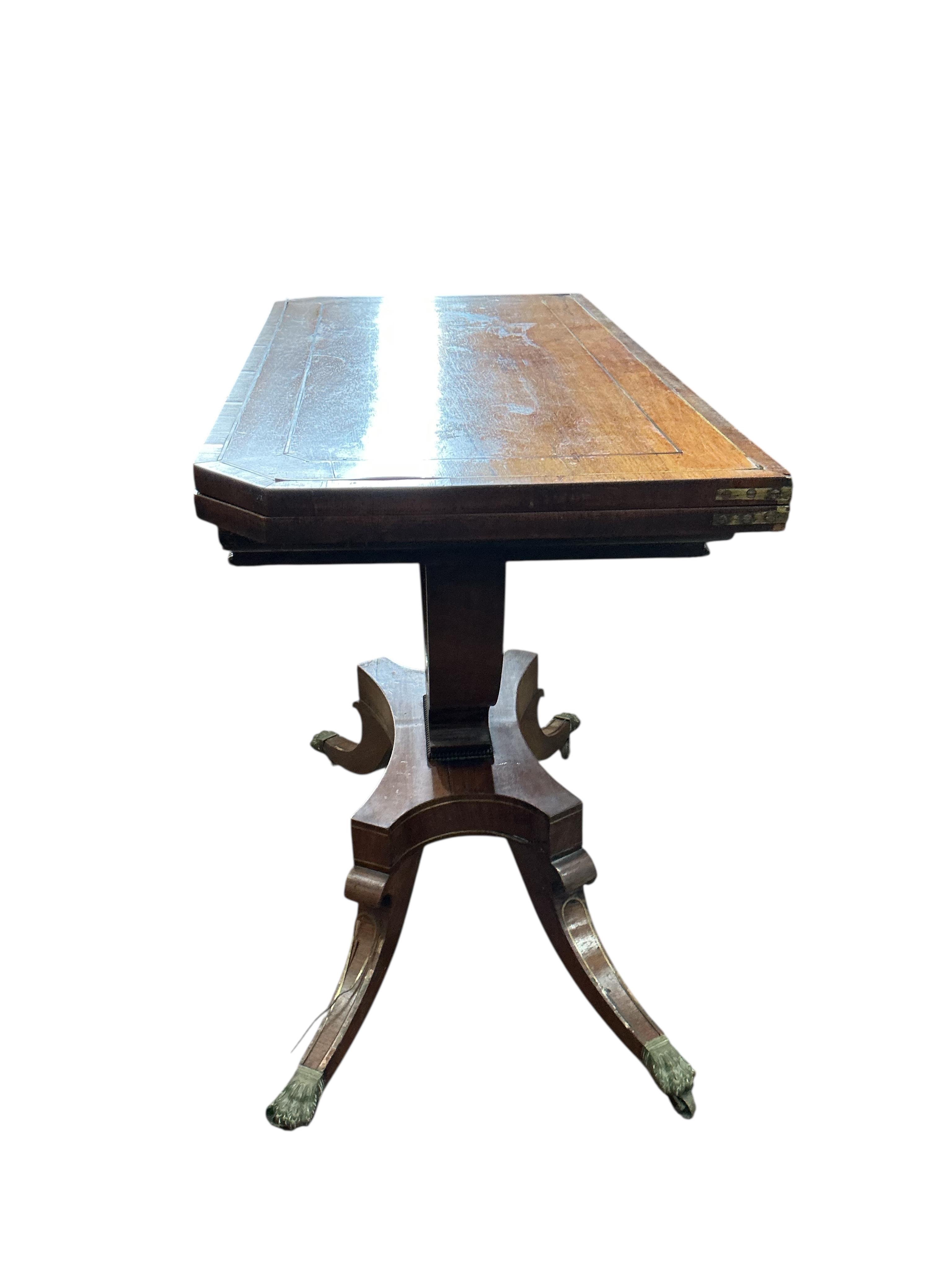 A Regency brass mounted rosewood folding card table, width 89cm, depth 44cm, height 74cm
